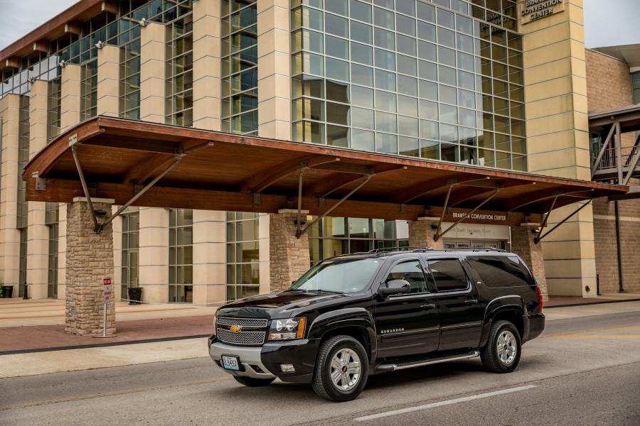 A black car in front of the Branson Convention Center