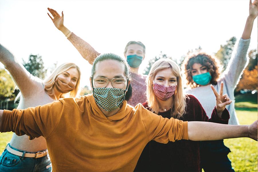 A group of people wearing masks.
