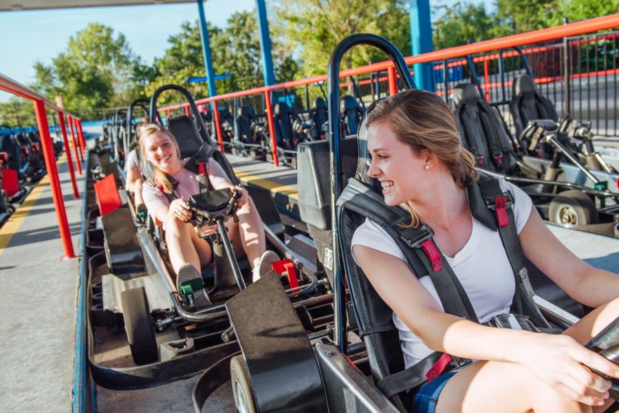 two girls are waiting to drive go-karts at the Track Family Fun park in Branson, MO