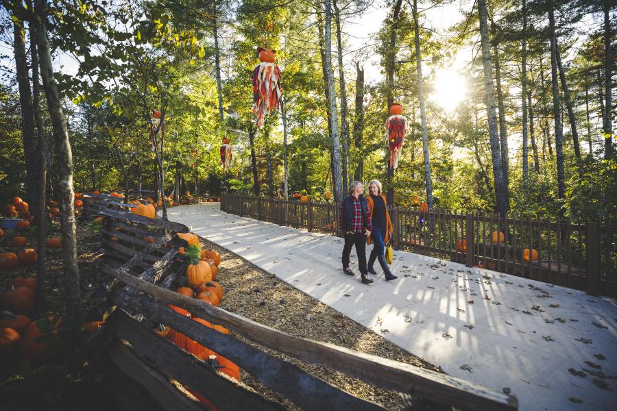 A couple walking through Silver Dollar City's Fall Fest