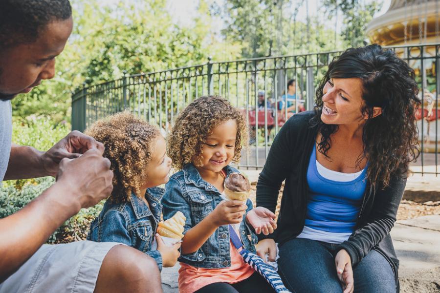 Family of four enjoys ice cream at Silver Dollar City, one of Branson’s top attractions.