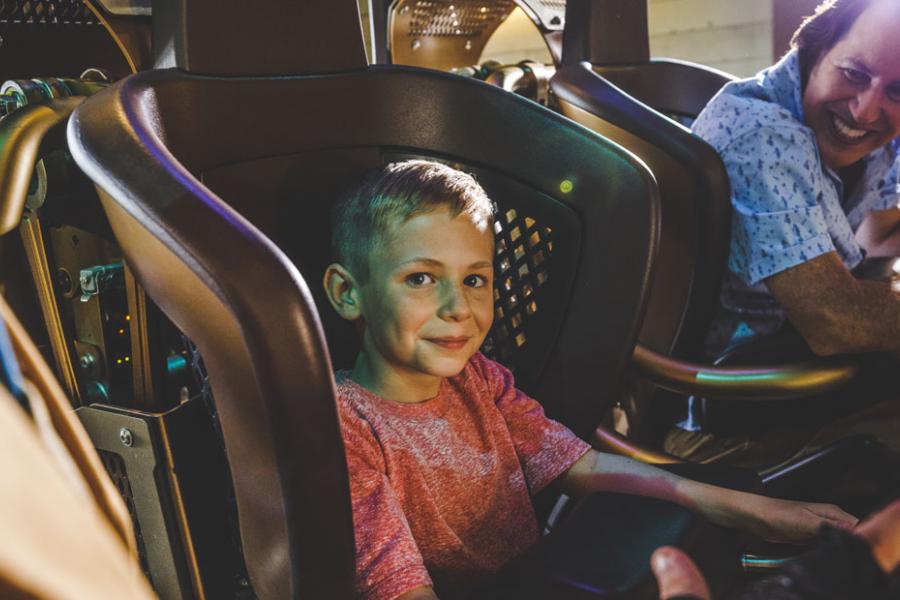 Father and son about to ride the world's tallest, fastest spinning coaster found in Branson.