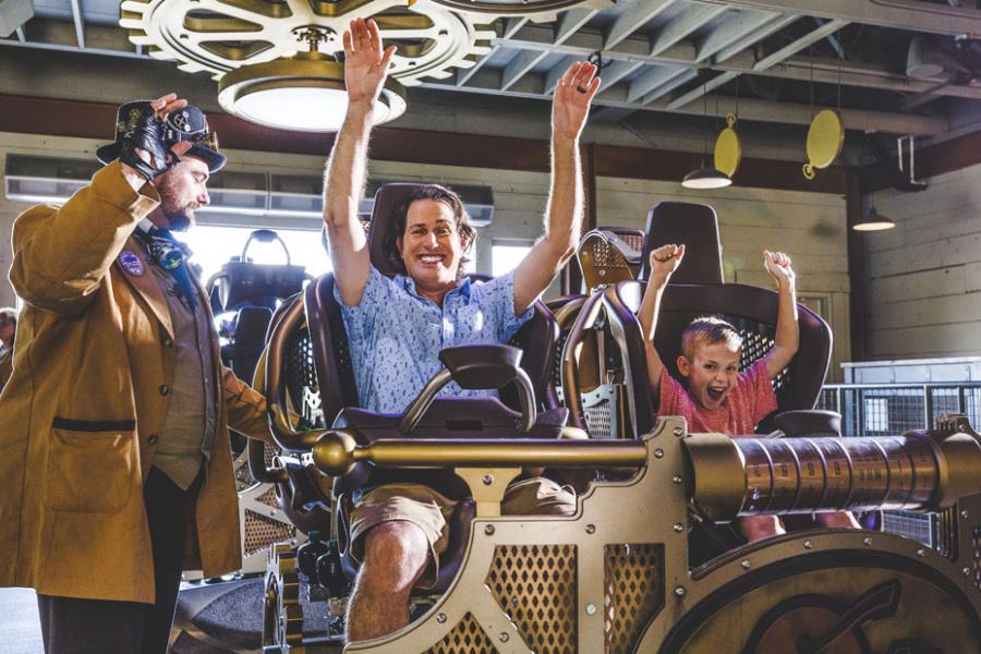 Father and son about to ride the world's tallest, fastest spinning coaster found in Branson. 