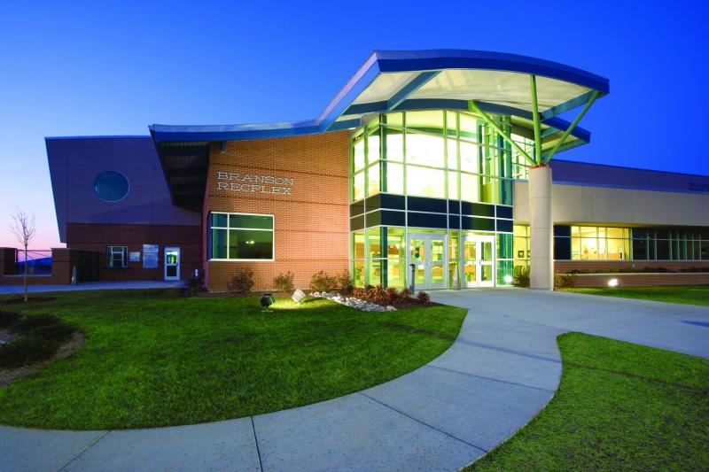 Exterior shot of a sporting venue at night.