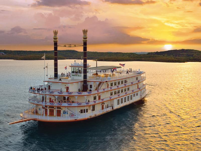 Sunset behind Showboat Branson Belle on the lake.