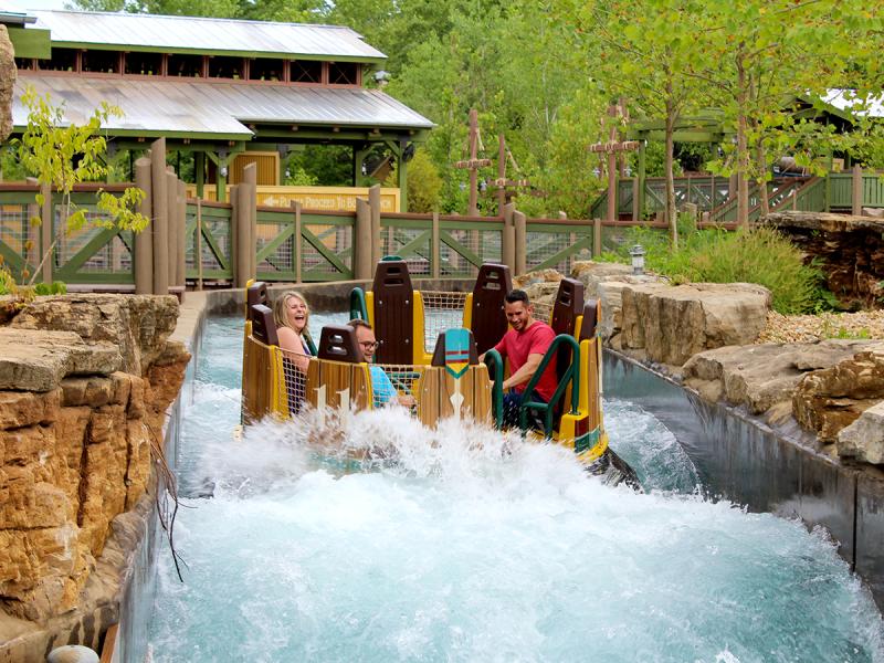 a family riding Mystic River Falls at Silver Dollar City.