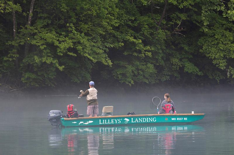 A group fishing during the early morning on Lake Taneycomo.