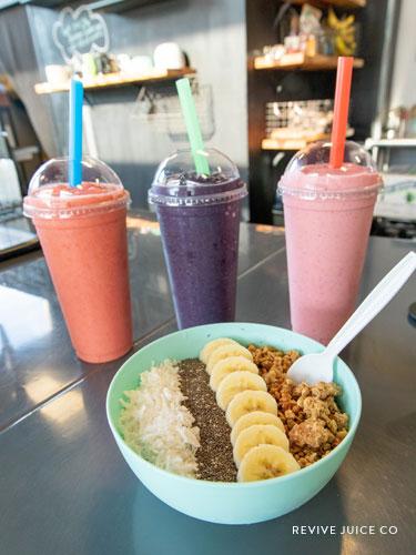 Three smoothies and a smoothie bowl at Revive Juice CO.