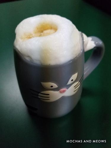 Mug of coffee served at a Branson cat cafe.