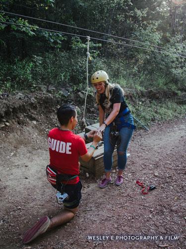 Man on one knee proposing to girlfriend.