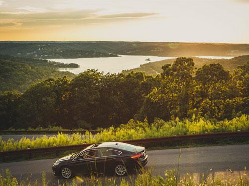 Car driving on scenic drive in Branson.