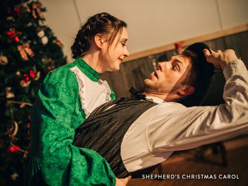 Man and woman about to kiss in a Branson live show.