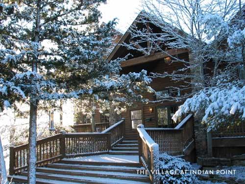 Winter cabin covered in snow.